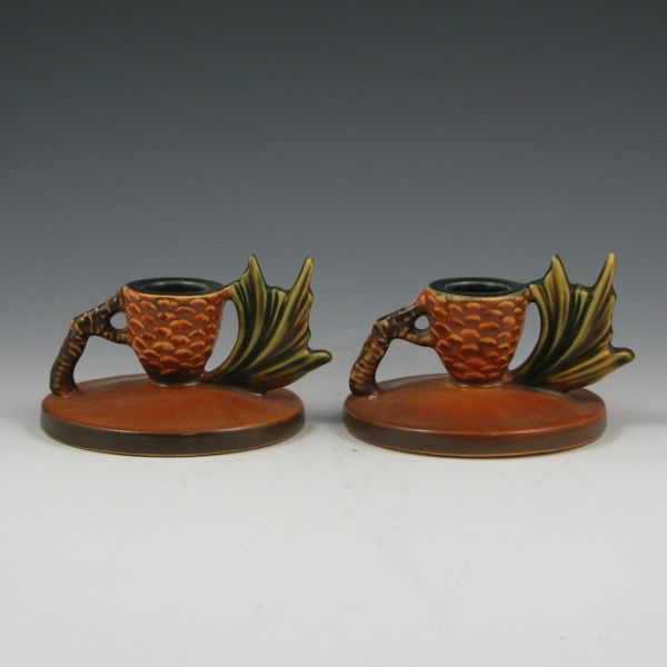 Appraisal: Pair of brown Roseville Pine Cone candleholders Marked Roseville Mint