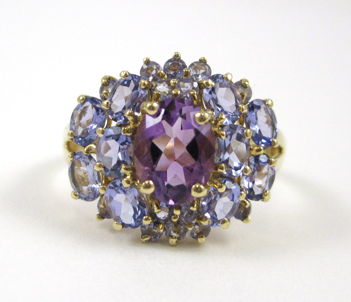 Appraisal: TANZANITE AND AMETHYST RING k yellow gold with ten oval-cut