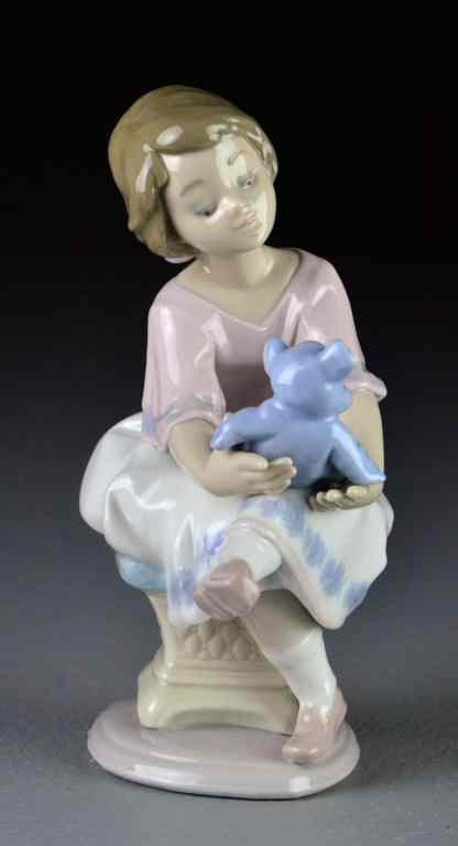 Appraisal: Lladro Porcelain Figurine ''Best Friend''''Columpiando al Osito'' depicting a young