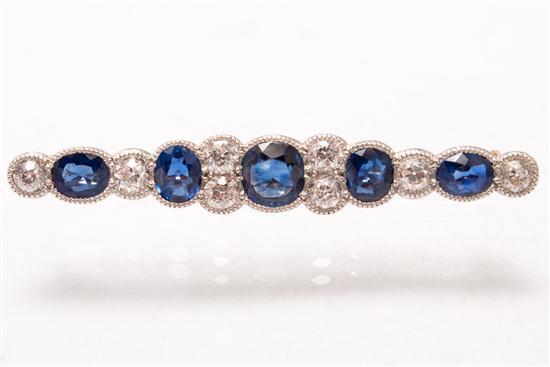 Appraisal: th century unmarked yellow gold diamond and sapphire brooch diamonds