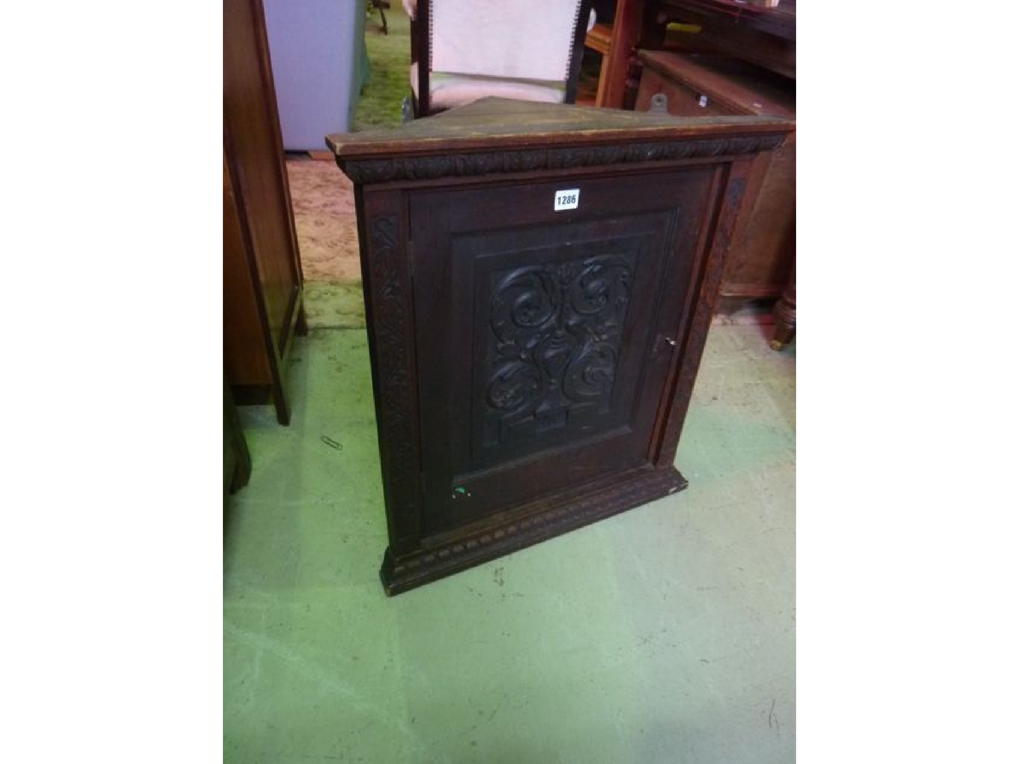 Appraisal: A th century carved oak hanging corner cupboard of small