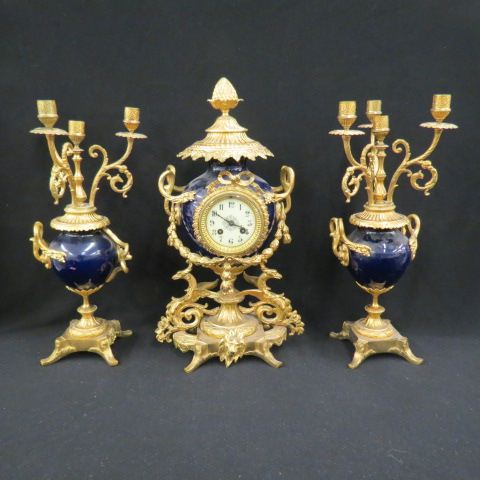 Appraisal: French Victorian Mantle Clock Set fancy bronze work on cobalt