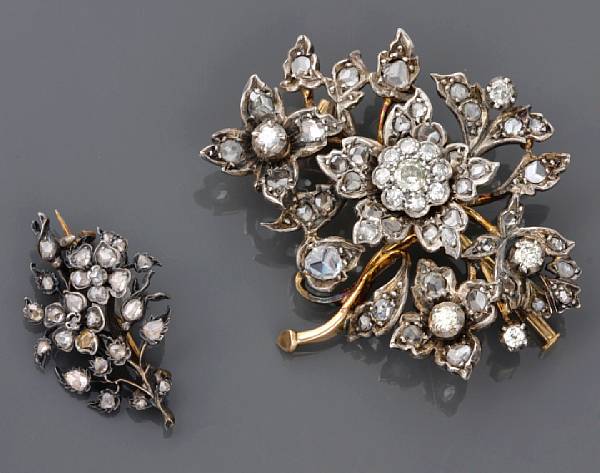 Appraisal: A collection of two diamond and silver-topped gold floral brooches