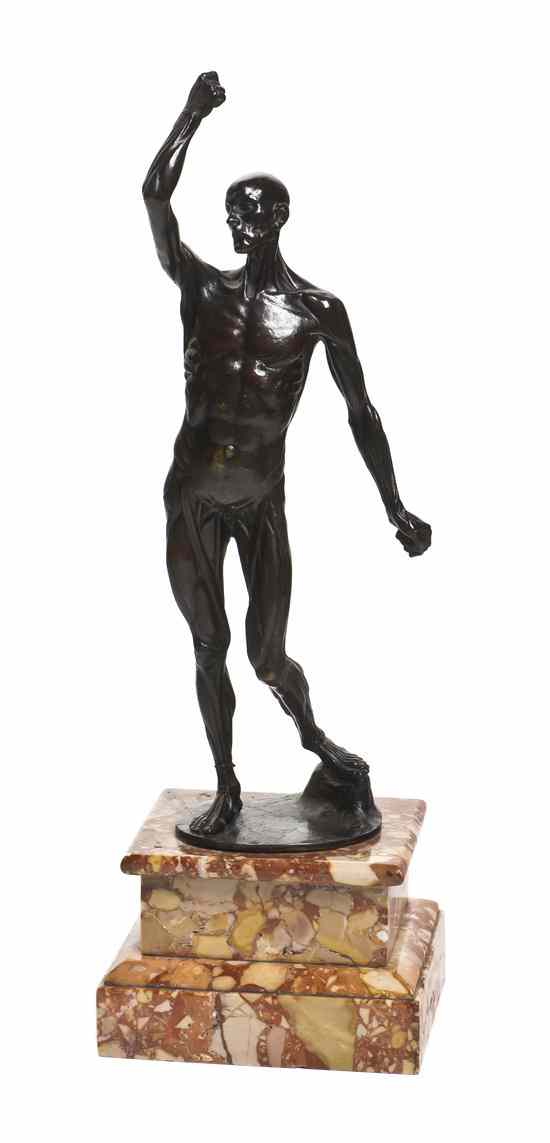 Appraisal: A Continental Bronze Figure depicting Saint Bartholomew in a standing