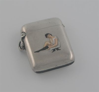 Appraisal: An Edwardian vesta case enamelled with an erotic girl by