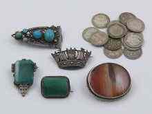 Appraisal: A mixed lot comprising four stone set white metal tests