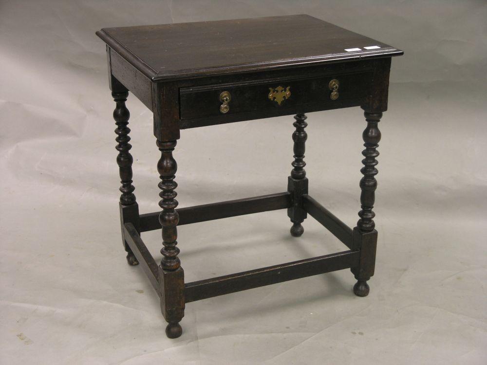 Appraisal: An th century oak side table with single frieze drawer