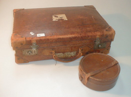 Appraisal: An old leather suitcase and a collar box