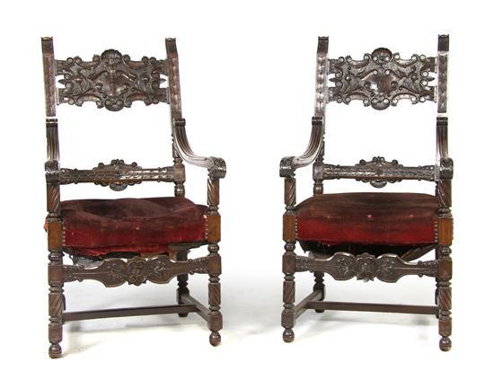 Appraisal: A Pair of Renaissance Revival Armchairs having carved horizontal splats