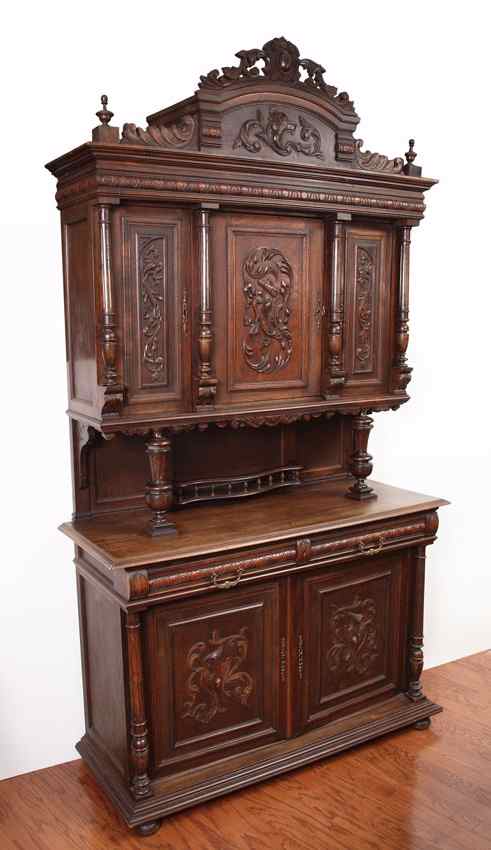 Appraisal: BELGIAN STEPBACK CARVED WALNUT COURT CUPBOARD Carved crest over architectural