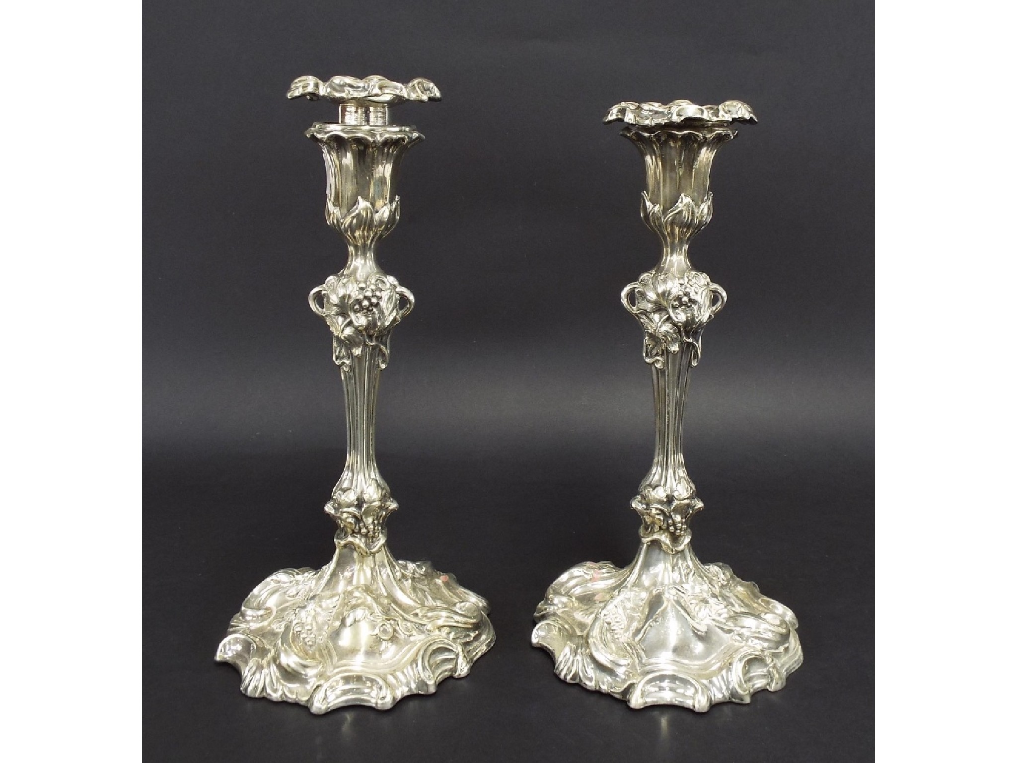 Appraisal: Pair of William IV silver candlesticks cast with grapevine and