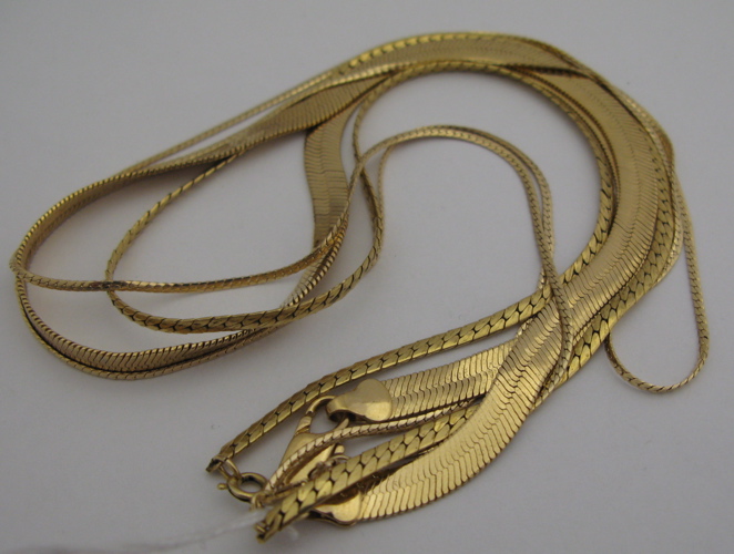 Appraisal: THREE YELLOW GOLD CHAIN NECKLACES including a Kgold chain weighing