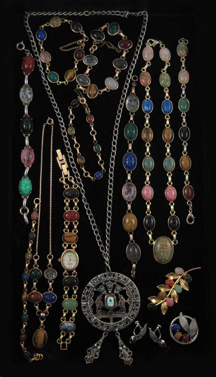 Appraisal: FIFTEEN ARTICLES OF SCARAB JEWELRY with three necklaces a lady's