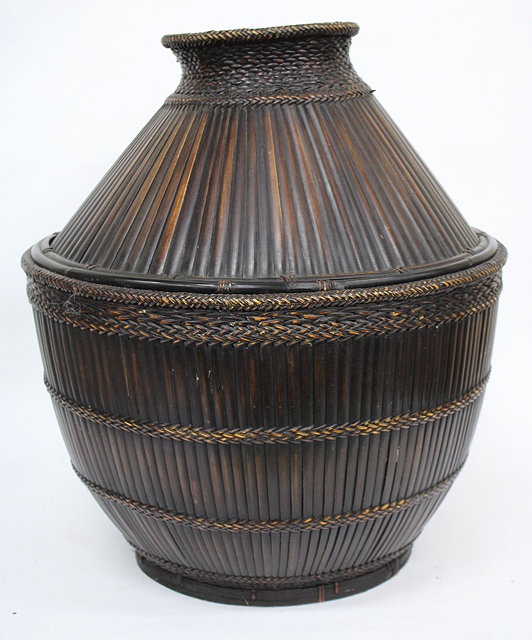 Appraisal: A PHILIPPINES LARGE STORAGE BASKET constructed from stripped bamboo approximately