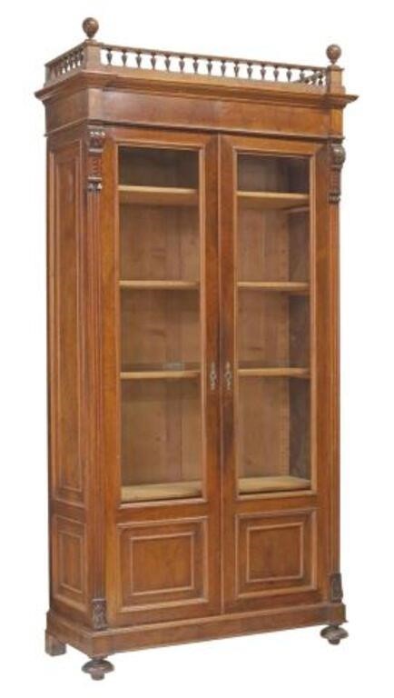 Appraisal: Italian walnut bookcase th c having spindled gallery over paneled