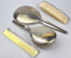 Appraisal: A Sterling four-piece brush set including hand-mirror