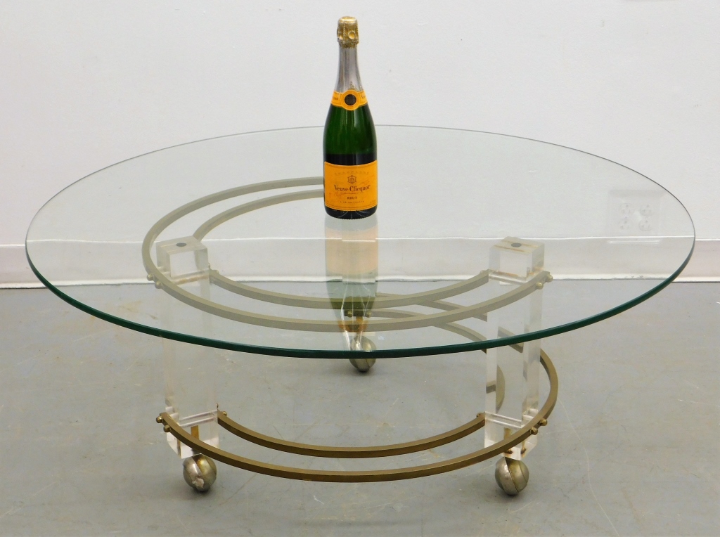 Appraisal: MCM BRASS LUCITE COFFEE TABLE United States th CenturyRound glass