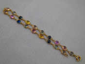 Appraisal: A yellow metal tests carat gold multi gem bracelet approx