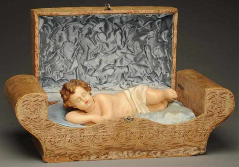 Appraisal: Italian Music Box with Wax Baby Beautiful music box sound