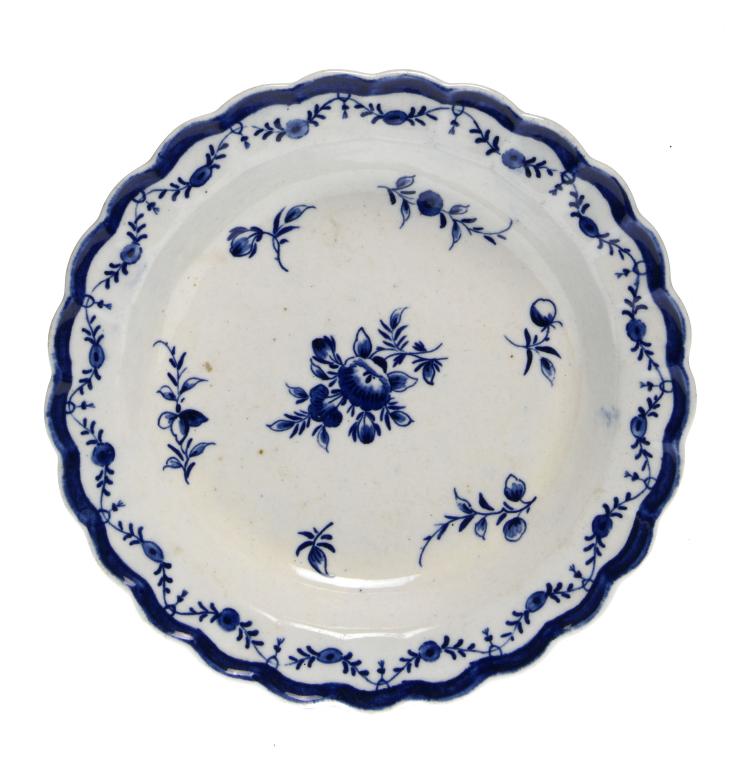 Appraisal: A FIRST PERIOD WORCESTER FLUTED PLATE painted in bright underglaze