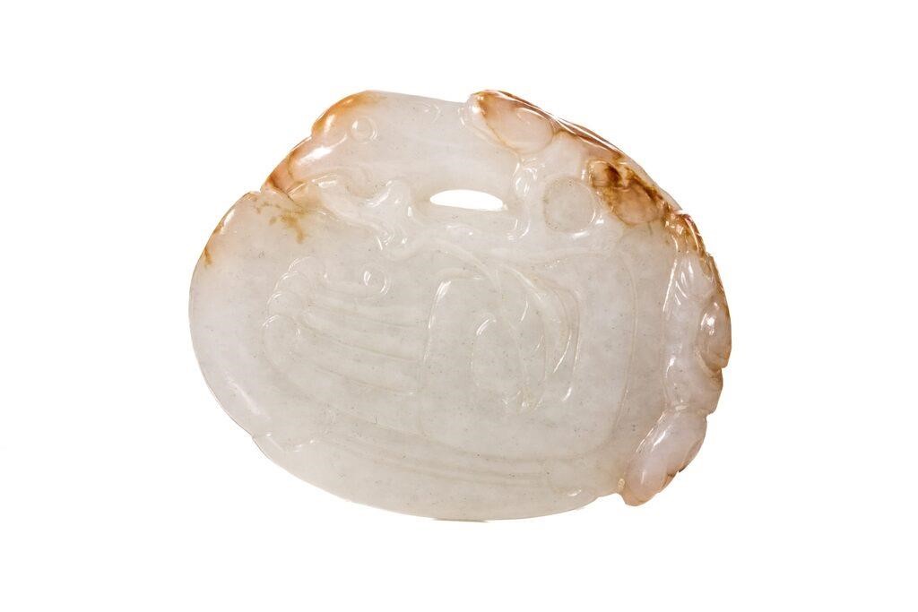 Appraisal: Chinese carved from a piece of white jade with russet