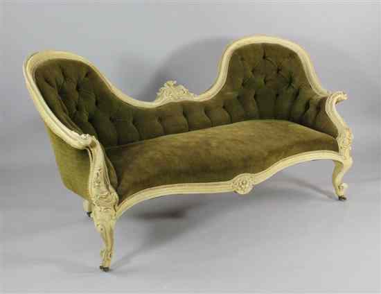 Appraisal: A Victorian white painted settee with scroll carved showwood frame