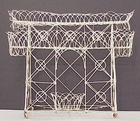 Appraisal: White painted wire two shelf plant stand with space for