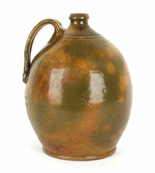 Appraisal: Large earthenware jug with green and ochre glazing th c