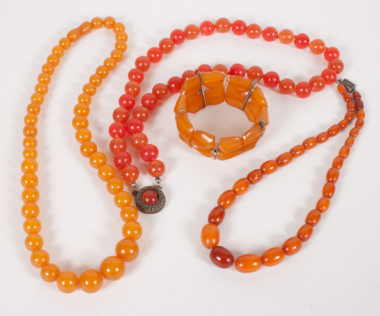 Appraisal: Three amber bead necklaces and a bracelet longest - in