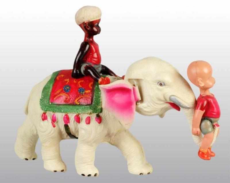 Appraisal: Celluloid Henry on Elephant Wind-Up Toy Description Japanese Pre-war Working