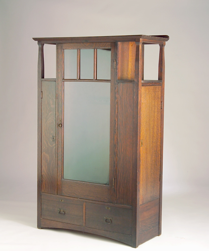 Appraisal: ARTS CRAFTS Gun cabinet with three doors and mirrored pane