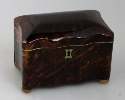 Appraisal: A tortoiseshell tea caddy circa of serpentine outline the hinged