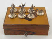 Appraisal: A set of Thai metalware place-name or menu holders stamped