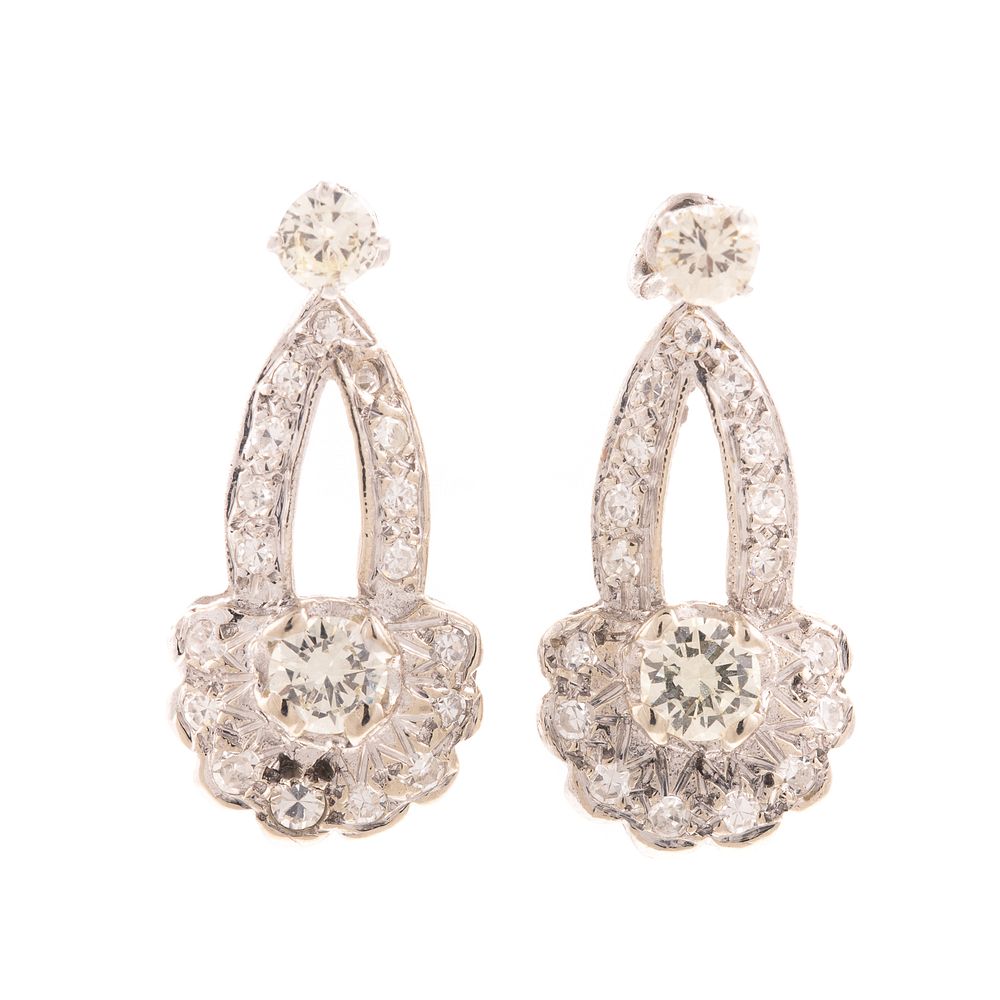 Appraisal: A Pair of K Diamond Studs with Diamond Jackets K