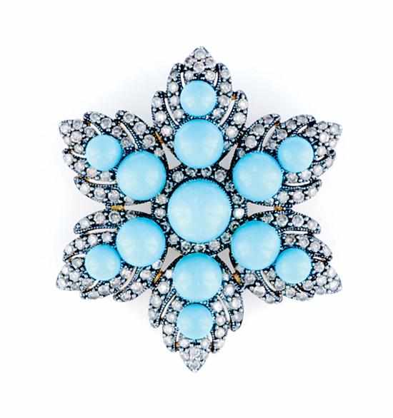 Appraisal: Champagne diamond and turquoise brooch early th century openwork floral-leaf