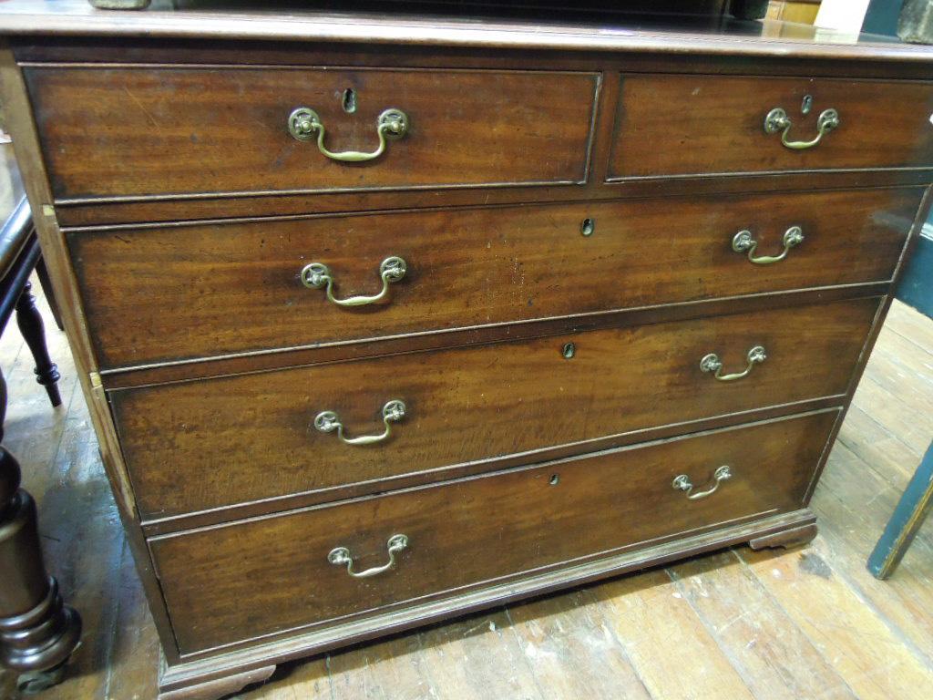 Appraisal: A Georgian mahogany chest fitted with three long and two