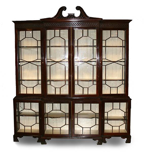 Appraisal: A George III style carved mahogany breakfront bookcase second half