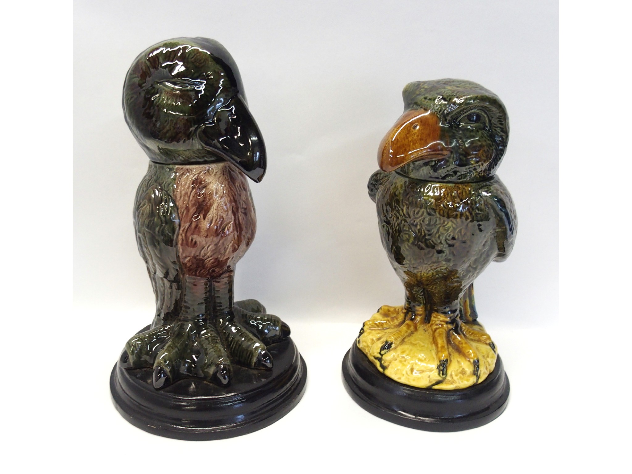 Appraisal: Two pottery bird shaped jars and covers