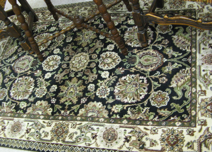 Appraisal: HAND KNOTTED ORIENTAL AREA RUG Indo-Persian overall floral design on