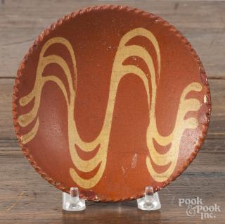 Appraisal: Pennsylvania redware toddy plate th c with yellow slip decoration