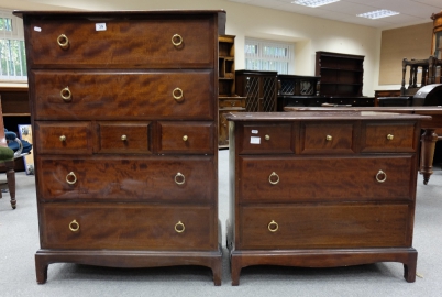 Appraisal: Mahogany Stag seven draw chest of drawers and similar smaller