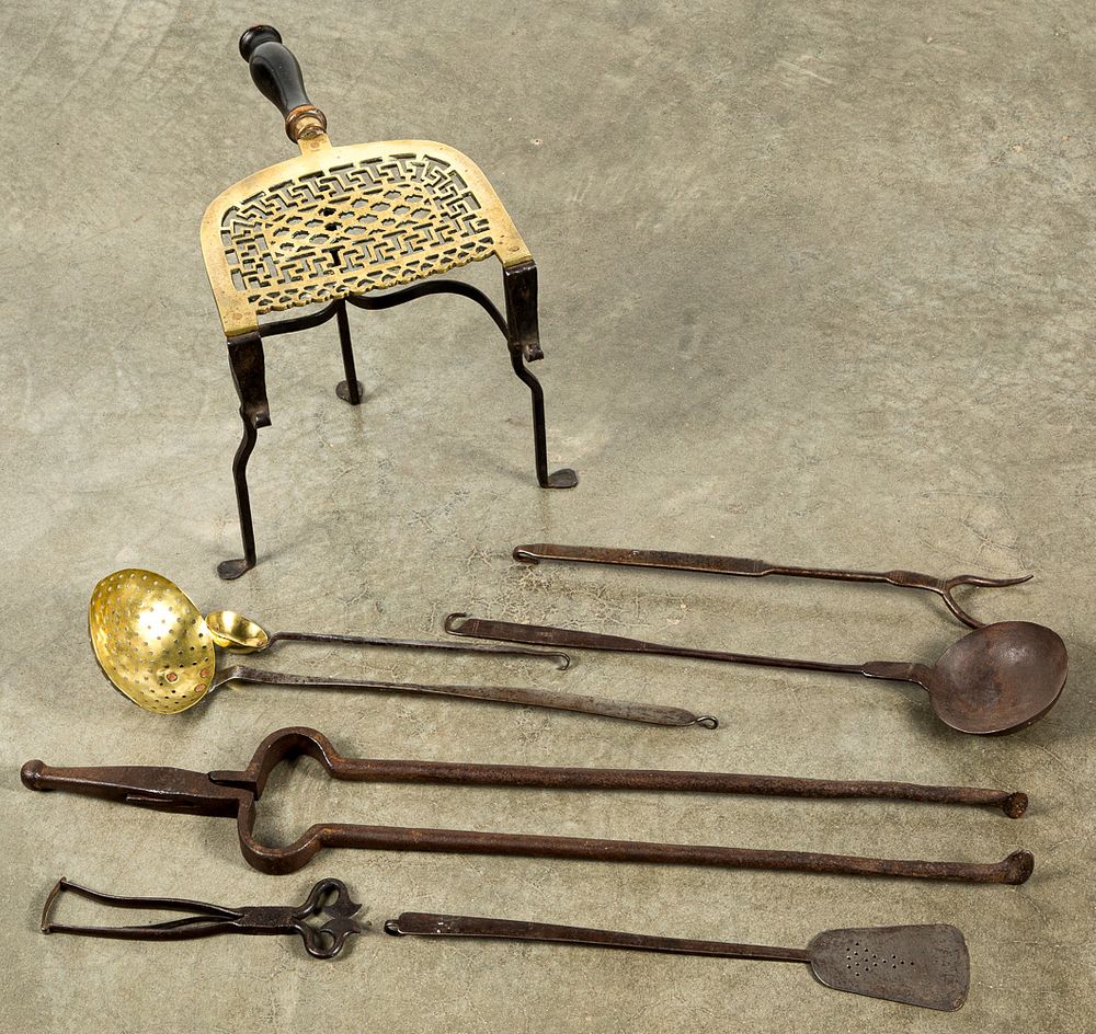 Appraisal: Iron and brass utensils trivet etc Iron and brass utensils