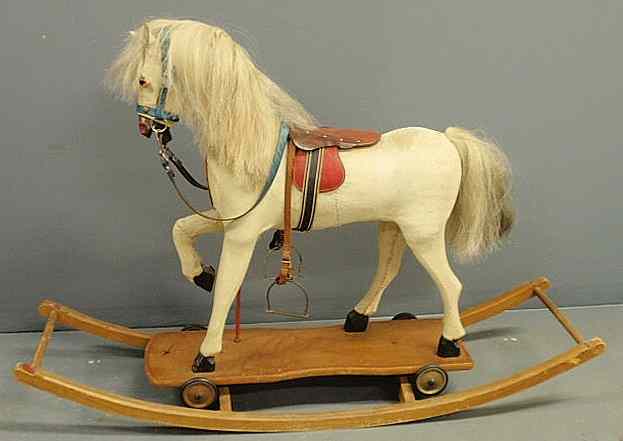 Appraisal: German rocking horse with original hide and painted base h