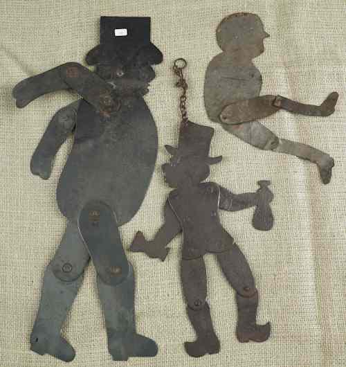 Appraisal: Three articulated tin toys th c tallest -