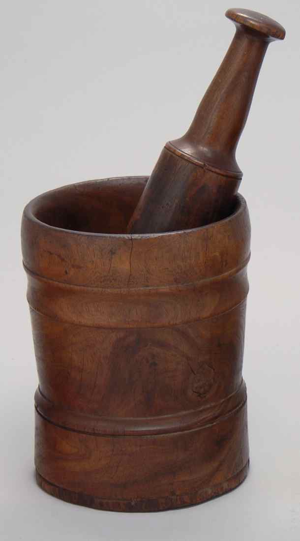 Appraisal: LIGNUM VITAE MORTAR AND PESTLE Late th Early th CenturyHeight