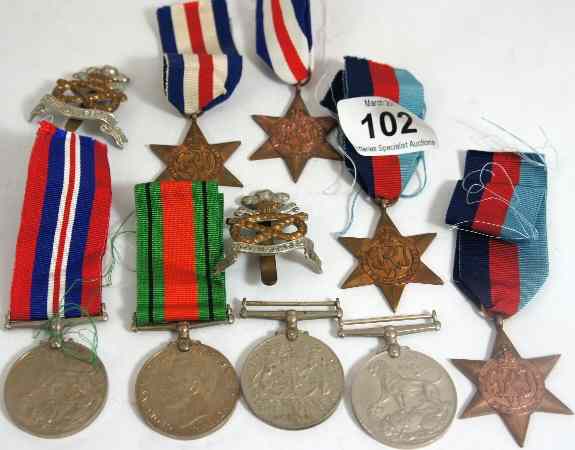 Appraisal: A collection of Second World War Medals and Cap Badges