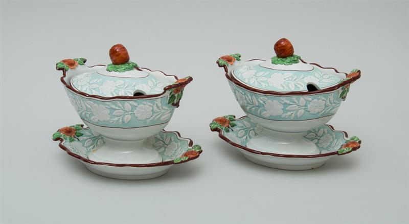 Appraisal: PAIR OF ENGLISH PEARLWARE SAUCE TUREENS AND ATTACHED STANDS Each