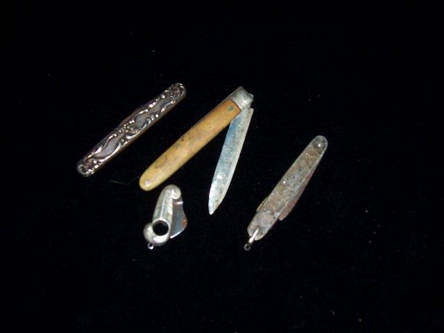 Appraisal: A pocket knife with embossed silver handle HM Birmingham and