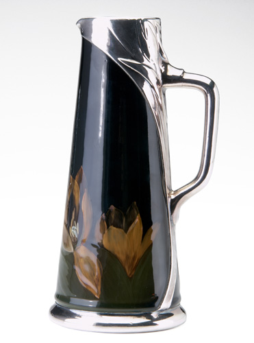 Appraisal: ROOKWOOD Rare Black Iris-Glaze tankard with silver overlay painted and