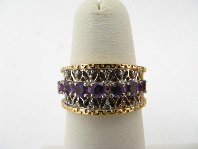 Appraisal: K yellow gold filigree amethyst and diamond dome ring C